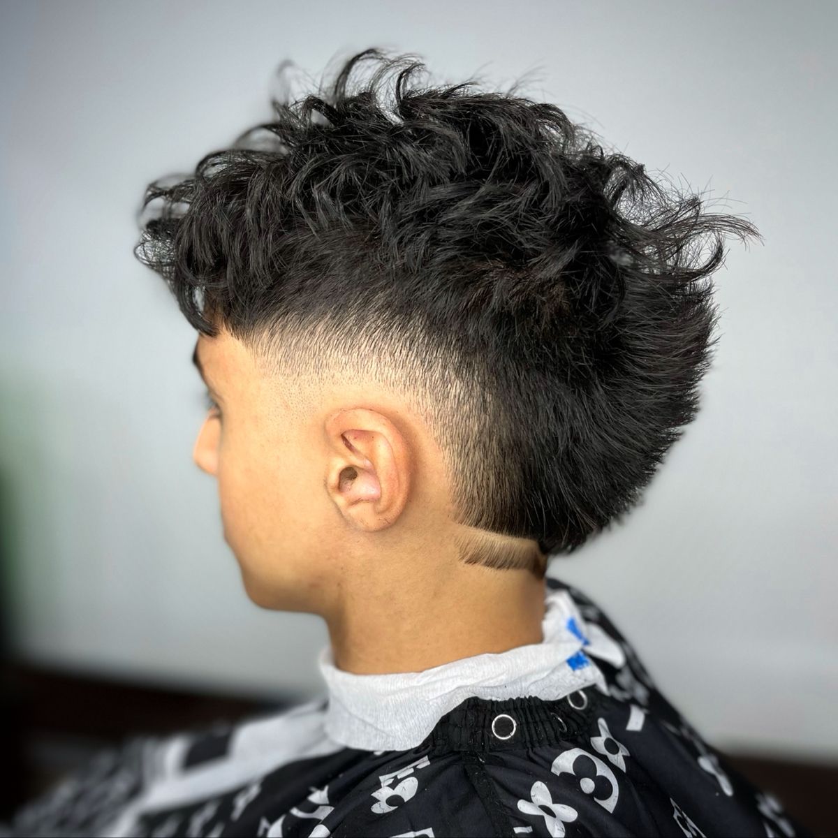 10 Best Burst Fade Mullet Curly Hair Style for Men 2023